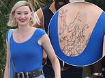 Sophie Turner cracks a relaxed smile and flashes HUGE barbed wire temporary back tattoo  as she films drama Joan in Spain amid  shock divorce from Joe Jonas