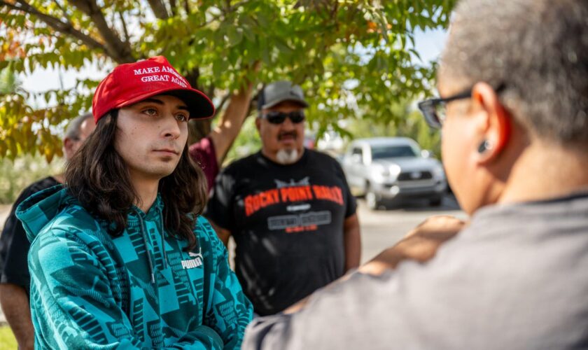 Suspect in Maga hat arrested after protester shot during demo against statue of conquistador in New Mexico