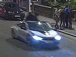Shocking moment two men fall off friend's BMW sports car while they try to take picture of a rapper - before driver led police in a 115mph chase