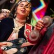 This photo taken on June 24, 2023 shows Moroccan artist Asmaa Hamzaoui, a female member of a traditional Gnawa band, performing during the 24th edition of the Gnaoua World Music Festival in Essaouira