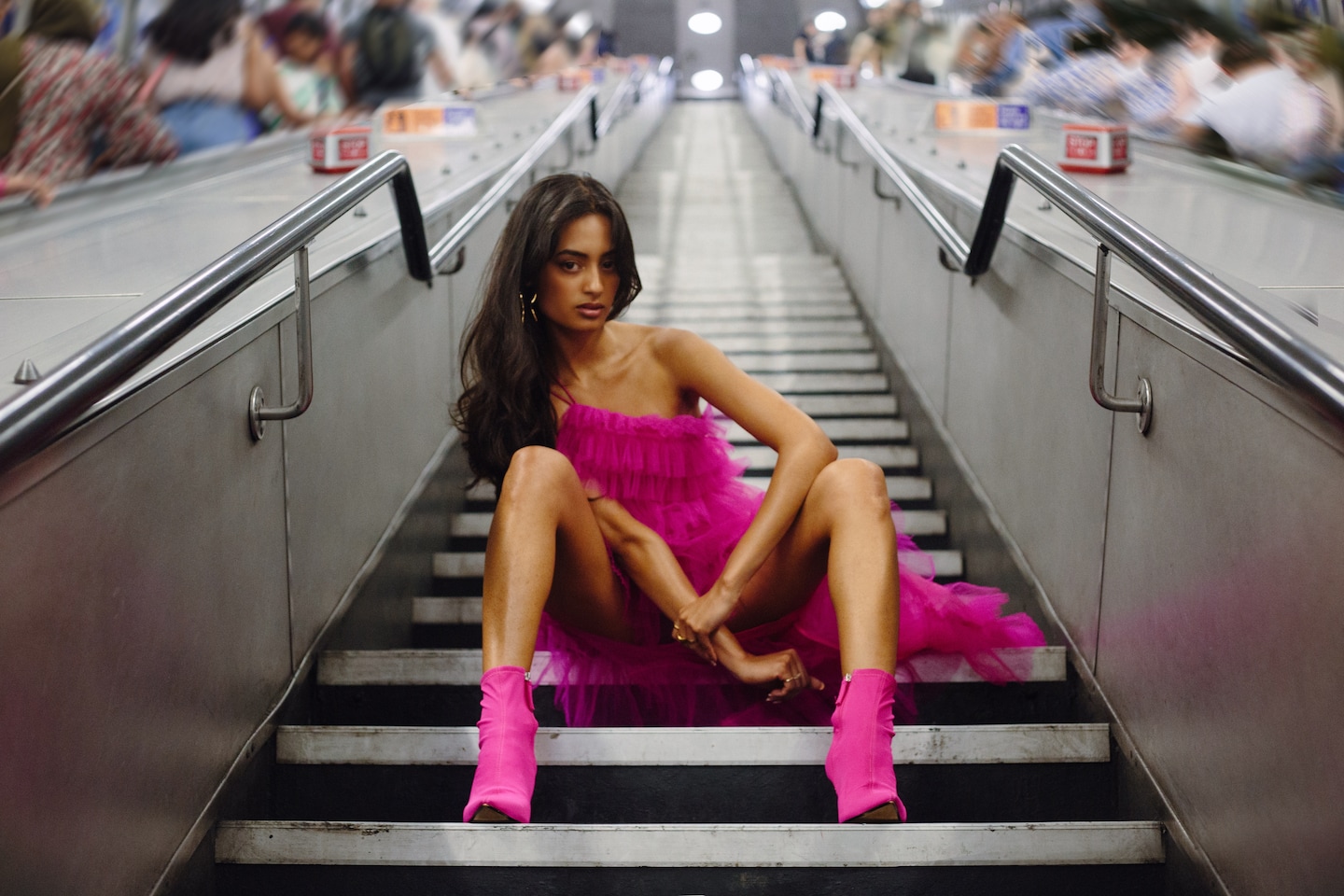 The Tube Girl is selling confidence — and her audience is lining up