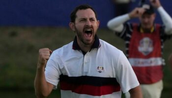 United States' Patrick Cantlay celebrates after holeing his putt on the 18th green to win the afternoon Fourballs match by 1 at the Ryder Cup golf tournament at the Marco Simone Golf Club in Guidonia Montecelio, Italy, Saturday, Sept. 30, 2023.