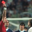 FILE - England's David Beckham receives a red card from Danish referee Kim Milton Nielsen for kicking Argentina's Diego Simeone, during England's World Cup second round soccer match against Argentina, in Saint Etienne, France on June 30, 1998. England lost on penalties after the match ended 2-2. A four-part Netflix series, "Beckham," explores Beckham’s upbringing and his triumphs on the field, but perhaps the most difficult part was revisiting his painful sending off during England’s World Cup m