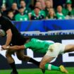 New Zealand's Will Jordan, left, scores a try as Ireland's Hugo Keenan tries to stop during the Rugby World Cup quarterfinal match between Ireland and New Zealand at the Stade de France in Saint-Denis, near Paris, Saturday, Oct. 14, 2023. (AP Photo/Aurelien Morissard)