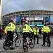 Police to step up presence at Wembley tonight for England's Euro 2024 qualifier with Italy after gunman killed two Swedish football fans in Brussels