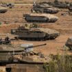 Israeli soldiers gather in a staging area near the border with Gaza Strip, in southern Israel, Tuesday, Oct. 24, 2023. (AP Photo/Ohad Zwigenberg)