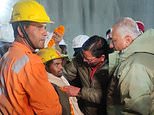 Free at last! Construction workers emerge from collapsed Indian road tunnel where they have been trapped for 17 days as rescue team pulls them all to safety through pipe built through the rubble
