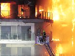 Tourists are among 14 people missing and feared dead in Valencia apartment block inferno in addition to four victims known to have died when fire spread in Grenfell Tower-like disaster - as firefighters prepare to search for bodies