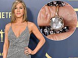 Jennifer Aniston sparks engagement speculation by wearing HUGE diamond ring at the SAG Awards - after revealing she will 'never say never' to marriage despite having 'no interest'