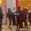 Moment 300 children storm shopping centre, causing mayhem by charging through mall, screaming and clashing with security - as police issue dispersal order following 'antisocial' chaos