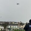 A UK police officer launches a drone. File photo