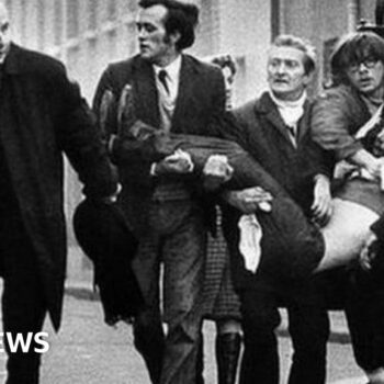 A victim of Bloody Sunday is carried through the streets of Derry