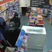 Shocking moment armed thugs point gun at terrified shopkeeper in till raid