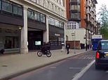 Shocking moment bike-riding thief swoops to snatch man's mobile phone out of his hand in London's Park Lane