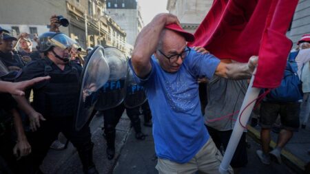 Argentine retirees and soccer fans clash with police during protests against austerity measures – AP News