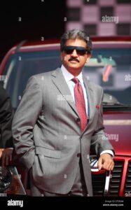 Anand Mahindra’s Bold Challenge to Elon Musk on Tesla’s India Launch: “Meet You at…