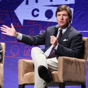 Tucker Carlson Commands the Spotlight at Turning Point USA Event in Indiana