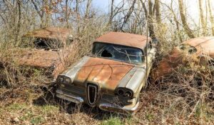 Discover the Haunting Beauty of a Vintage Car Graveyard in Western Germany Through Stunning Photos